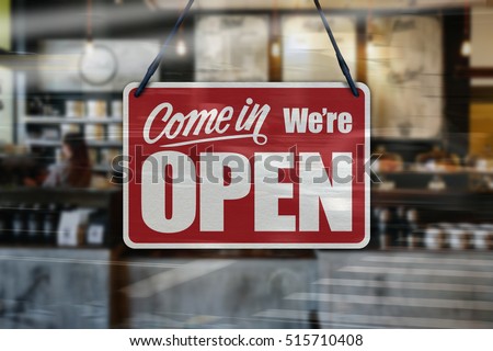 A business sign that says 'Come in We're Open'.