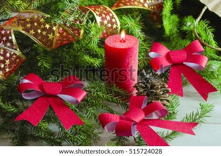 New Year and Christmas background with candles decorated Christmas tree in red