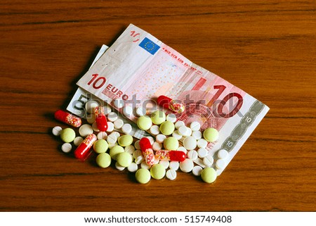euro paper money and medical pills as part of paid treatment