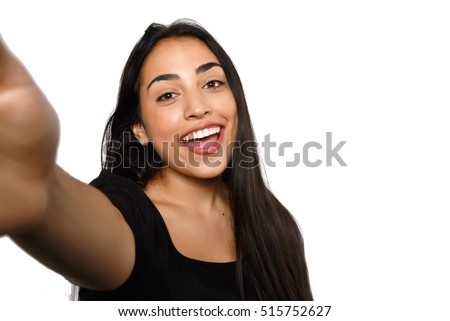 Close-up of young beautiful woman taking selfie. Isolated white background Royalty-Free Stock Photo #515752627