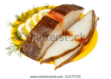 Halibut fish with lemon and dill on a yellow plate. Isolated on white background
