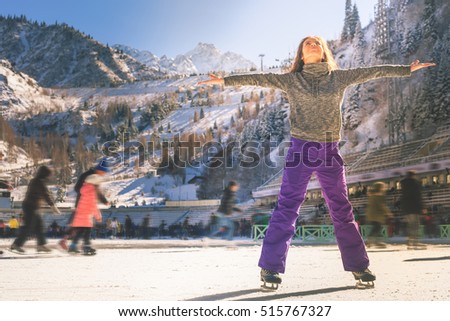 Latin girl ice skating outdoor at rink. Healthy lifestyle