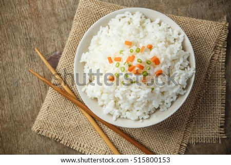 Steamed rice close up with chopsticks on burlap