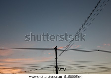the power lines and the sky in the evening
