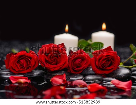 Still life with red rose with two candle and therapy stones 