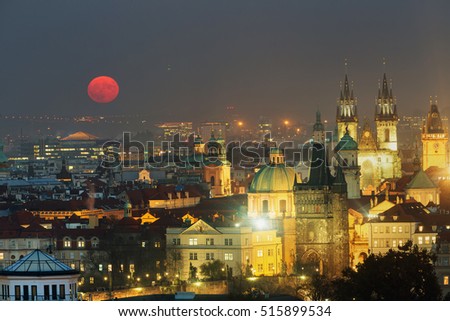 Full moon in Prague Old Town panoramic photo view. Towers of Church of Our Lady before Tyn, Prague, Czech Republic