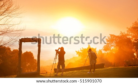 Morning sunrise over mist with tourist and photographer, Huai Nam Dang National Park, Chiang Mai, Thailand, landscape, travel and nature concept