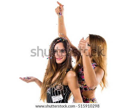 Happy young girls with confetti in a party