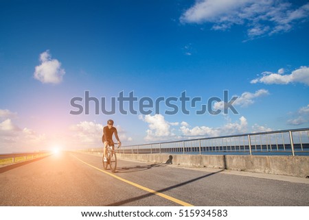 Asian men are cycling road bike in the evening