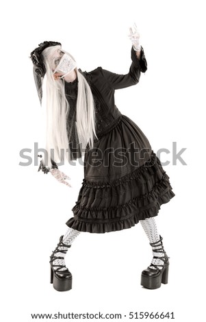Widow in a black dress with white eyes looking like a doll isolated in white