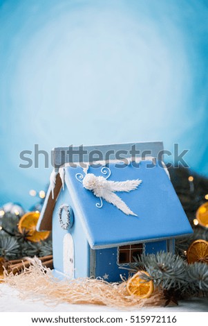 Winter's Tale. Christmas magic and homeliness. Gingerbread house. Copy of space.