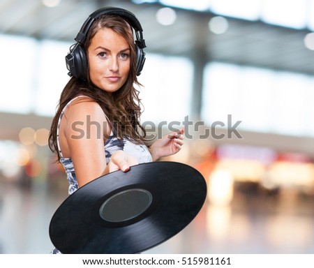 woman holding a vinyl