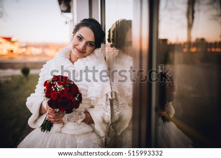 portrait of a beautiful bride with a bouquet of flowers. Close up picture woman with flowers.