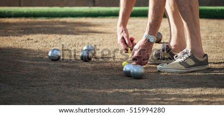 Petanque game,measuring the distance, deciding who's the winner