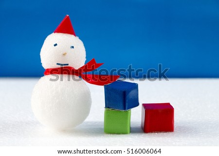 Smiling snowman and gift boxes on a white background.