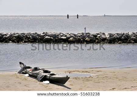 A new Kayak on a sandy Beach