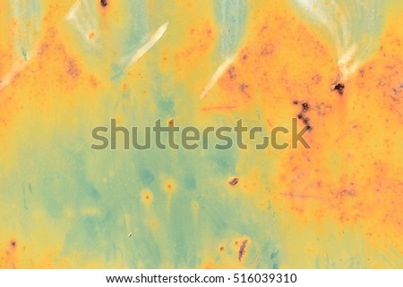 Green surface with yellow and orange inserts in the area,Background and texture from the old rusty steel sheet ,The effect of rust on metal