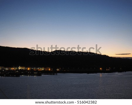 Twilight sky behind the mountain by the sea shore 