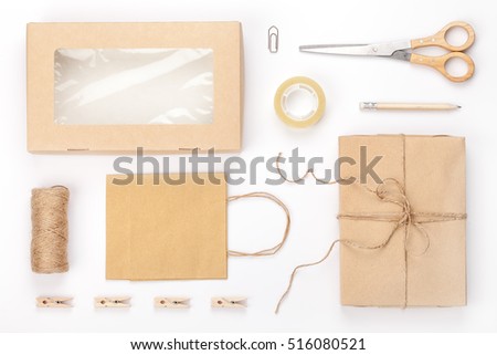 retro style branding mock up. wrapped gift, box, paper bag and wrapping tools on white background. delivery, mail and handicraft concept