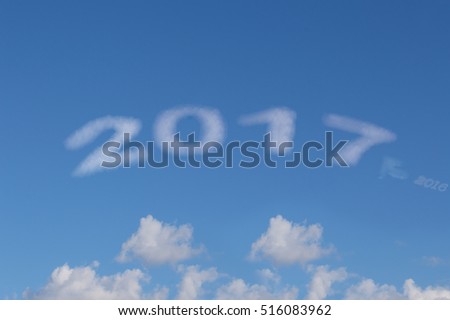 Image of number 2017 on the white cloud.Year 2017 on white cloud after 2016 passed.Blue sky background.