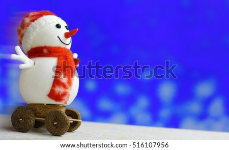 Christmas background with snowmen slides down on holiday bokeh lights. Foreground ready for product montage. Copyspace for sale price and item description. Concept market banner, advertising poster.