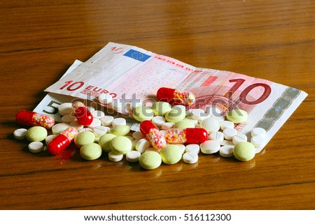 euro paper money and medical pills as part of paid treatment