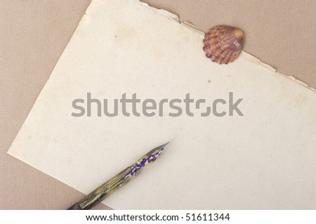 Paper pen and seashell