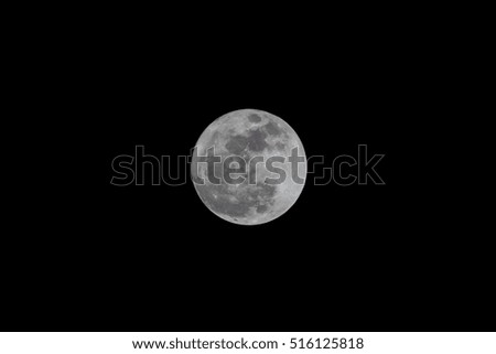 Super white full moon on clear black sky at night time