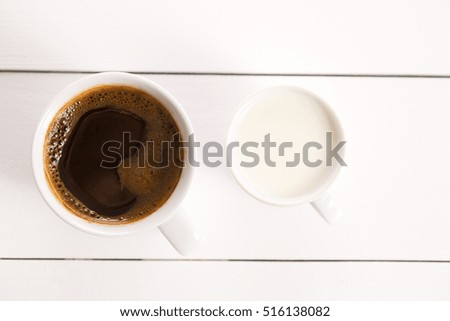 coffee in a cup close up on white wooden table