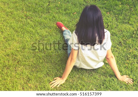 Portrait of a beautiful young asian girl relaxing in park