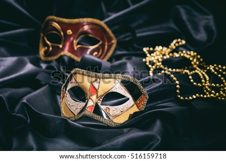 Carnival masks isolated on black satin background