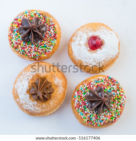 Fresh donuts with jelly and chocolate for Hanuka celebration. 