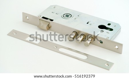 Door furniture. door mortise lock on a white background Royalty-Free Stock Photo #516192379