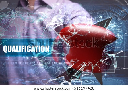 Business, Technology, Internet and network concept. Young businessman breaks the virtual future of the screen on which the inscription: qualification