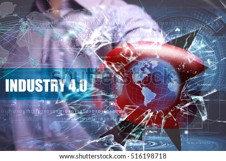 Business, Technology, Internet and network concept. Young businessman breaks the virtual future of the screen on which the inscription: industry 4.0 
