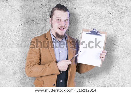 Young business man with a notebook