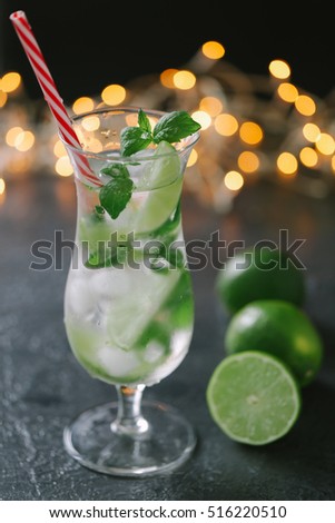 Mojito cocktail in a bur on a rustic table, selective focus, xmas theme