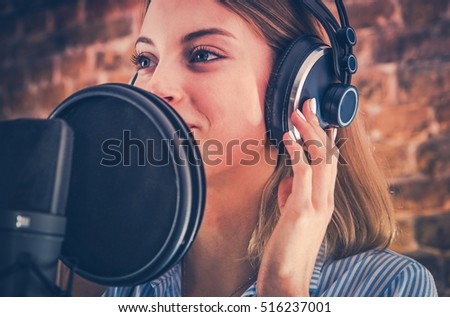 Woman Recording Audiobook. Audio Recording Studio Theme. Caucasian Voice Talent. Royalty-Free Stock Photo #516237001