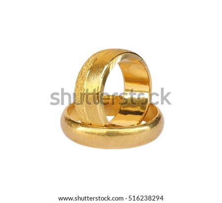 couple of gold wedding rings isolated on white background
