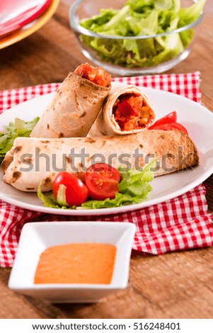 Tortilla wraps with chicken and vegetable. 