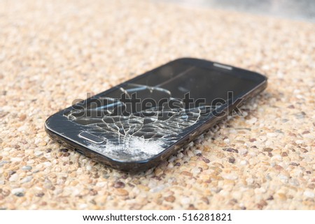 Broken glass of smart phone on  floor,broken smart phone