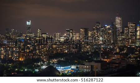 Urban lighted landscape of Toronto.   A balcony view of  lighted streets, parks, buildings and office towers on a hot & humid August night in capitol of Ontario, Canada,