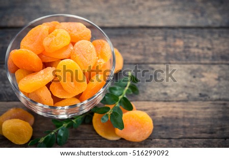 Dried apricots in the bowl Royalty-Free Stock Photo #516299092