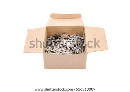 Cardboard box with metal detail, isolated on white background.