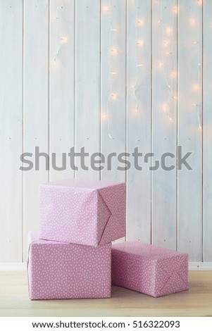Pink gift box with ribbon bow isolated on white background.