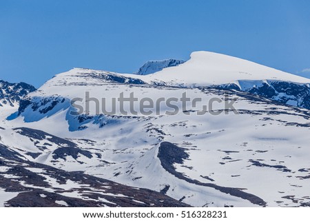 Snow covered Jotunheimen peaks in spring Norway