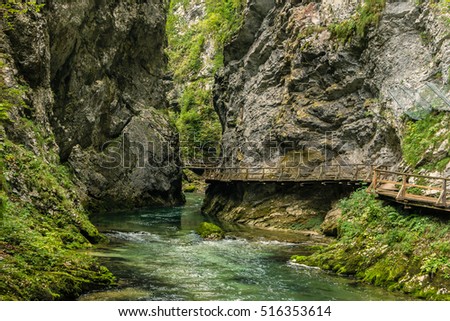 Vintgar Gorge, near Bled, Slovenia, part of Triglav National park. River Radovna is running through canyon, between rocks. Filled full frame picture. Beauty of nature. Wooden path hanging over river.