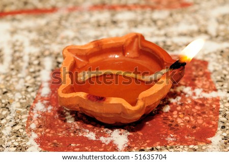   Oil lamp  on a tray at a temple.