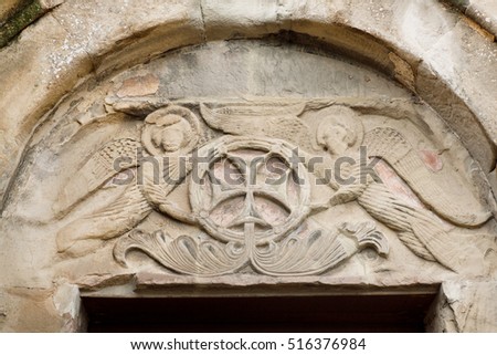 Relief with angels and cross on entrance of the Jvari Monastery, built in 6th century in Mtskheta, Georgia. World Heritage site by UNESCO