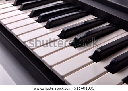 Close-up of electronic piano keyboard diagonally. Horizontal Composition. Elevated view